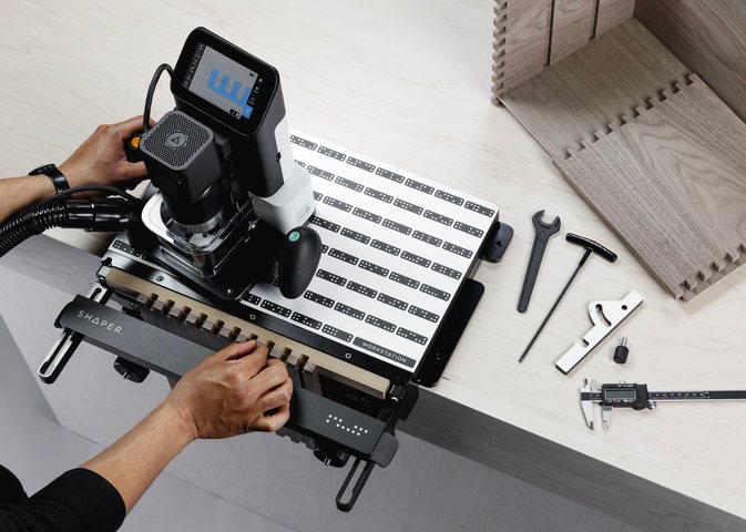 Shaper Origin in use, cutting on the Workstation